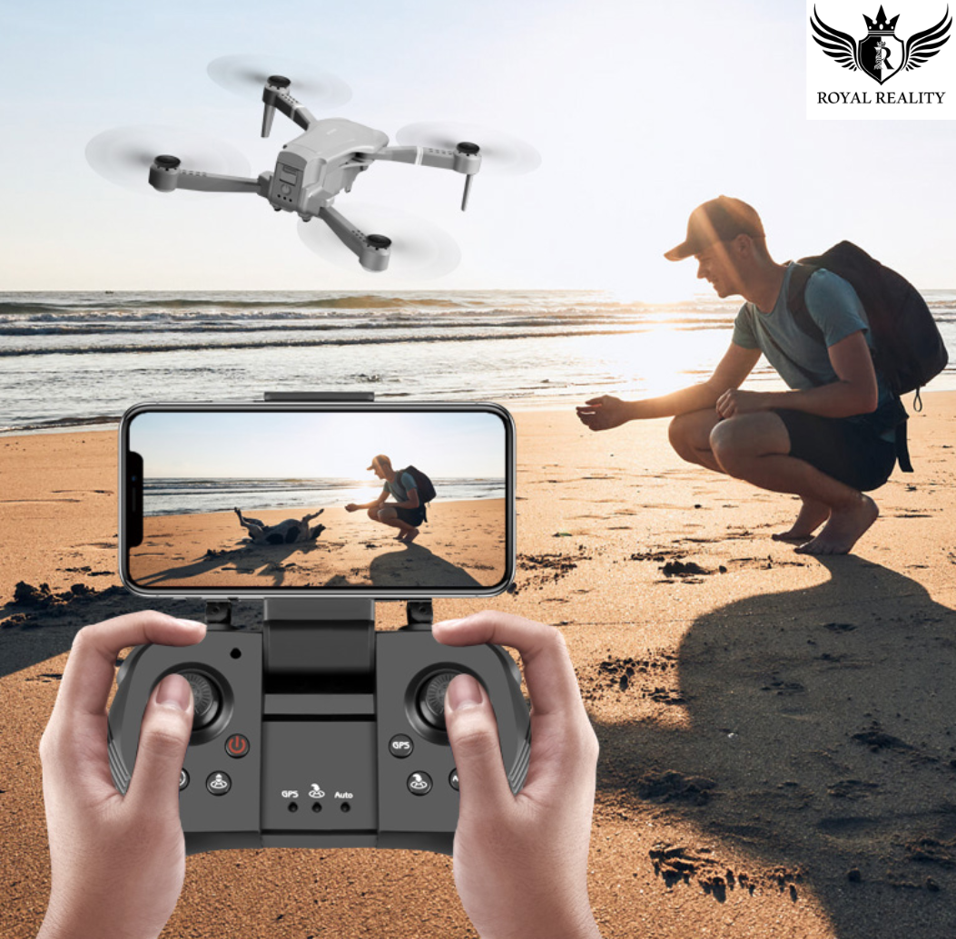 Person flying 4K foldable drone at the beach using smartphone controller