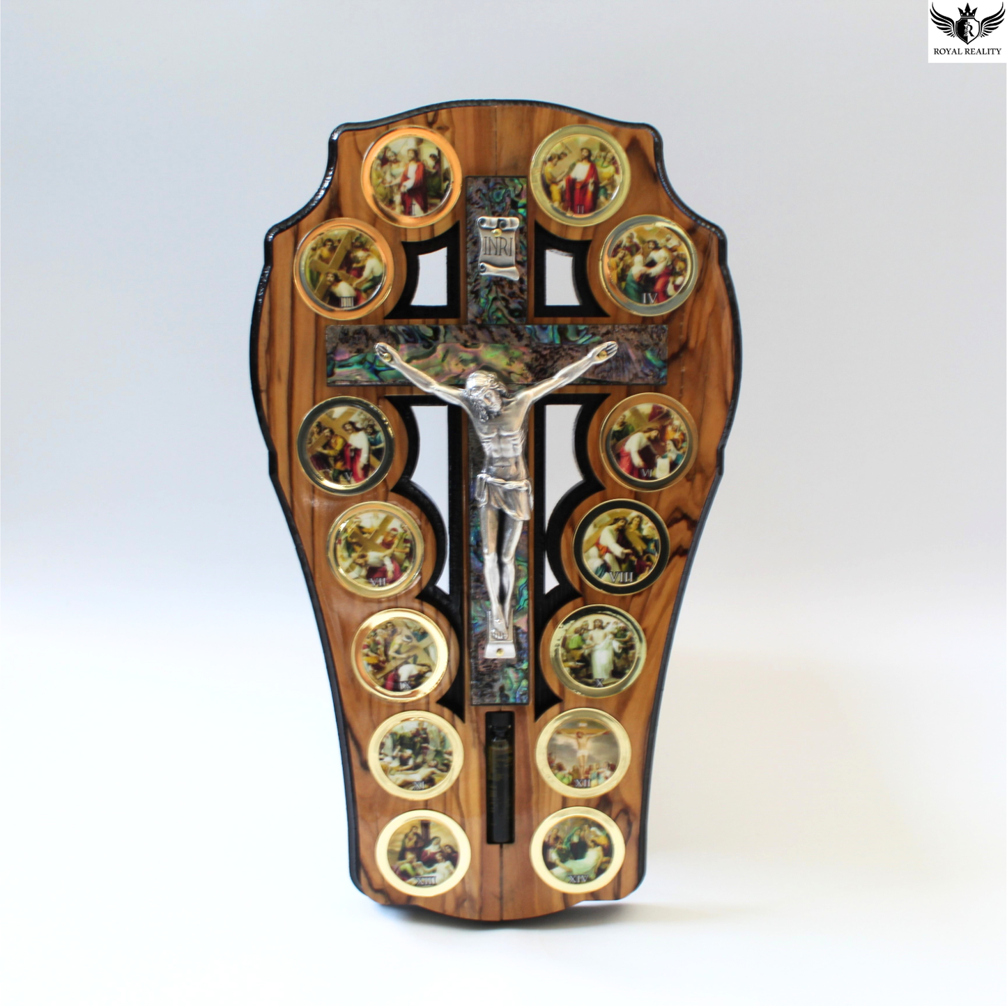 Wooden cross with religious iconography on a white background