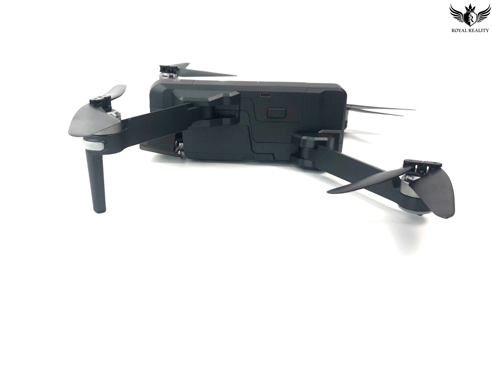 Black drone on a white background with 'Royal Reality' logo.