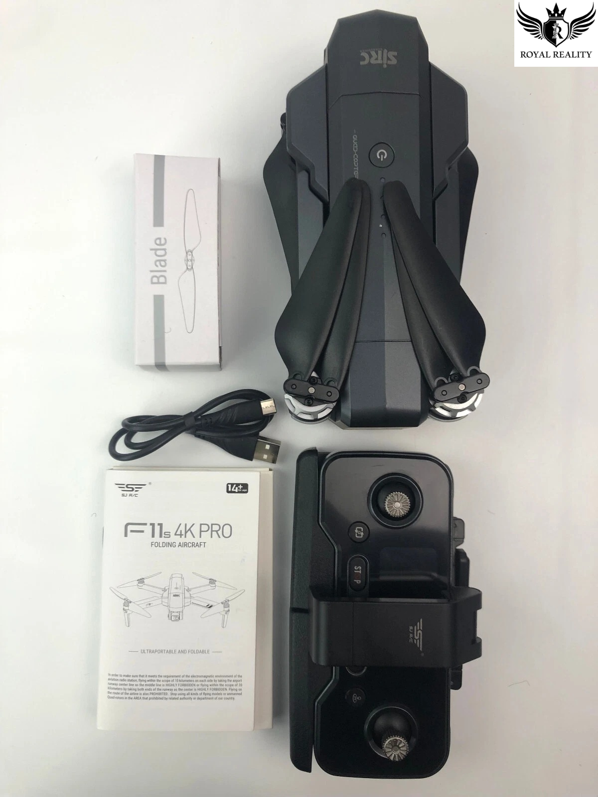 Black drone with packaging and accessories on a white background