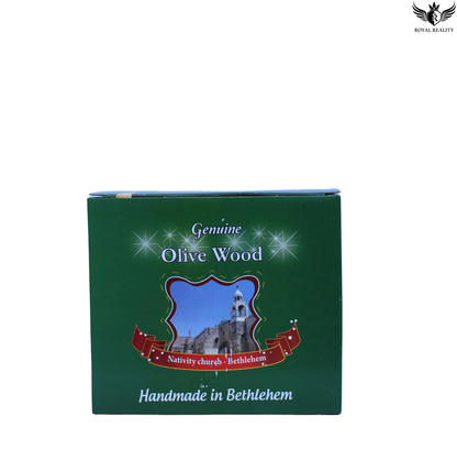 Green box with olive wood branding and Bethlehem Nativity Church illustration on a white background