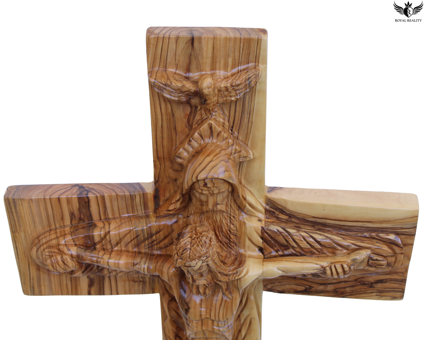 Wooden cross with carvings on a white background