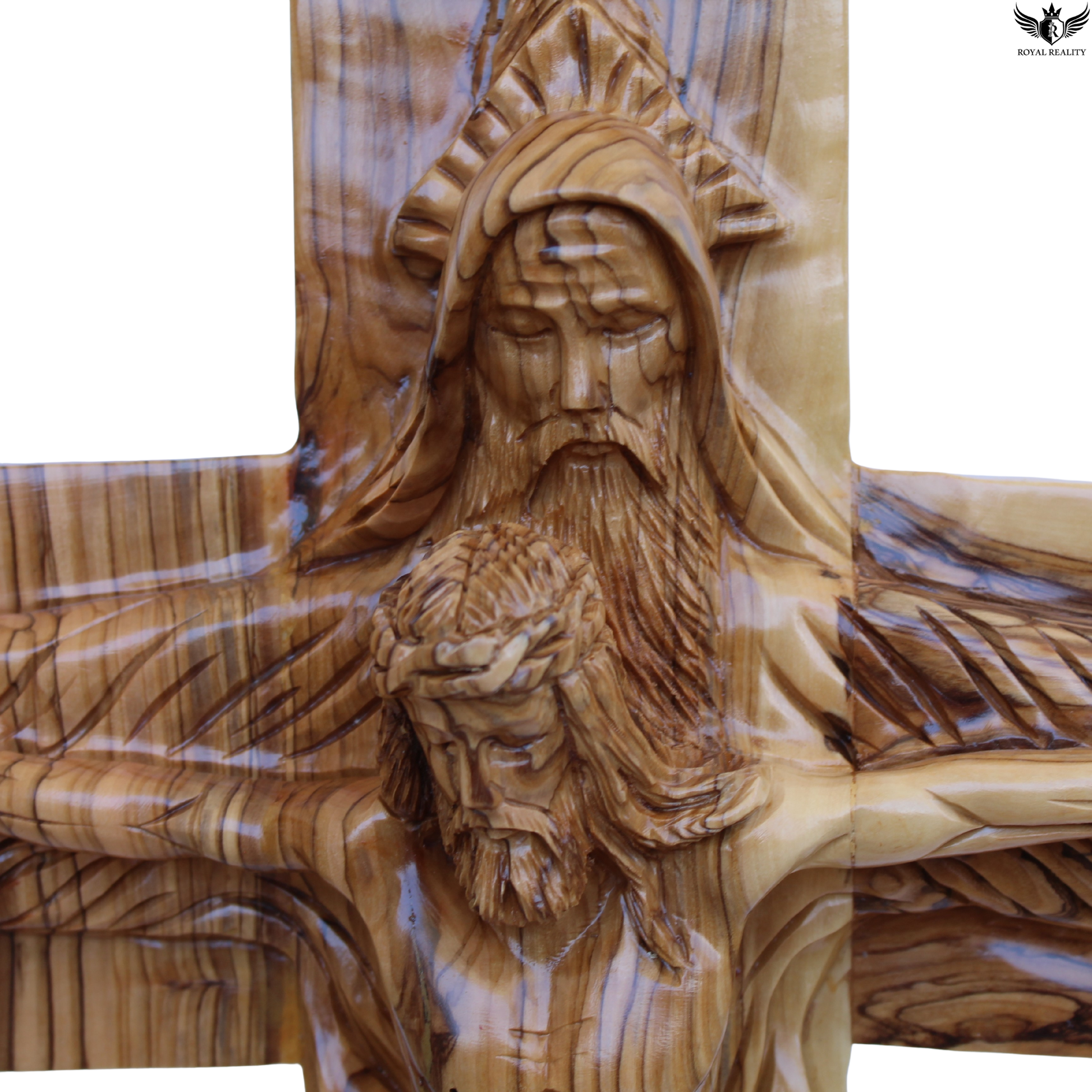 Wooden sculpture of a bearded figure on a cross with intricate details.