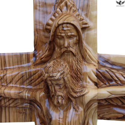 Wooden sculpture of a bearded figure on a cross with intricate details.