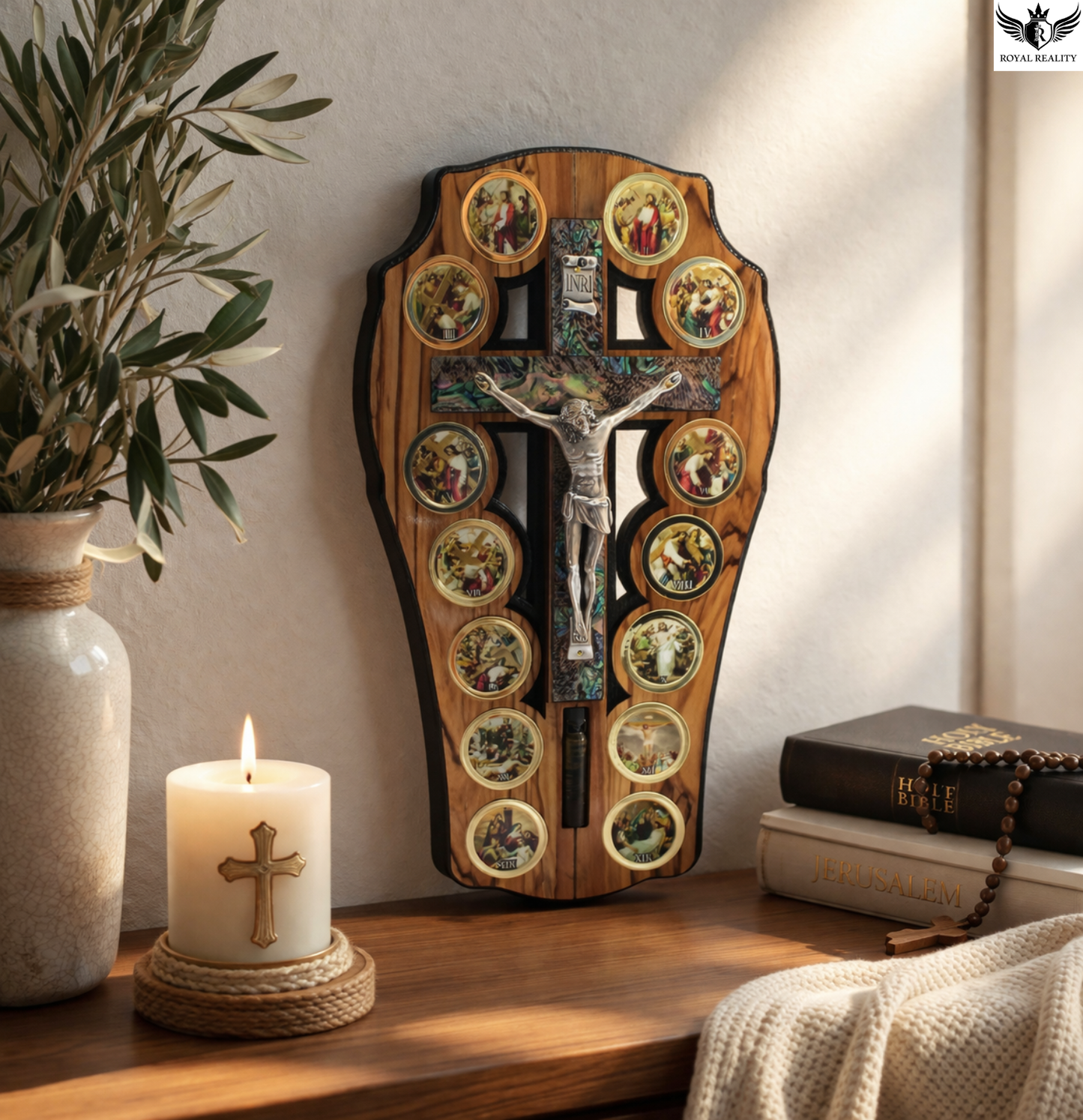 Wooden wall art with religious design featuring a cross and figures, placed on a shelf with a candle and plant.