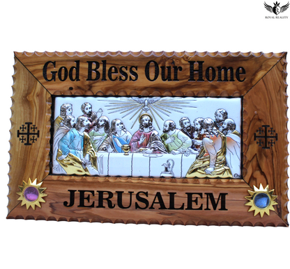 Decorative plaque with religious scene and 'God Bless Our Home, Jerusalem' text in a wooden frame.
