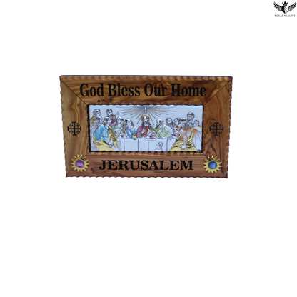 Wooden plaque with 'God Bless Our Home' and 'Jerusalem' text, featuring an image of the Last Supper.