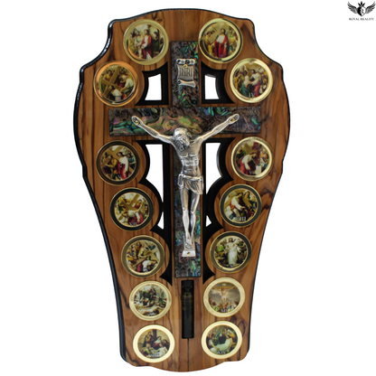Wooden cross with religious scenes and a crucifix on a white background