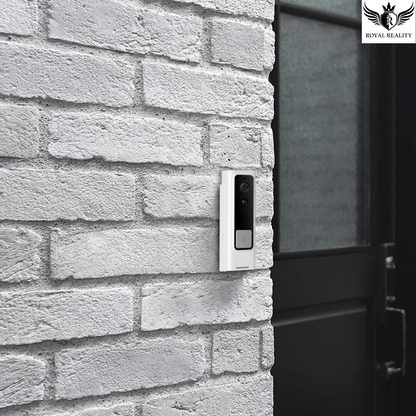 Smart doorbell mounted on a brick wall next to a door