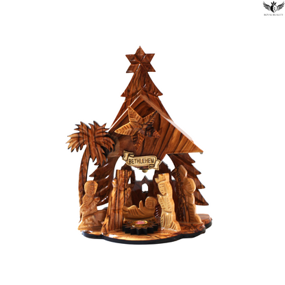 Wooden nativity scene with 'Bethlehem' sign on a white background