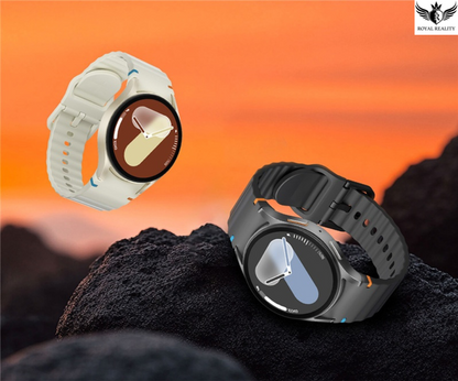 Two smartwatches on a rocky surface with an orange sky background
