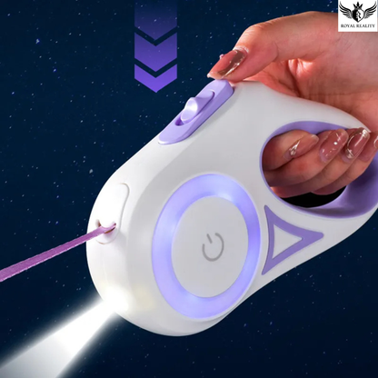 Hand holding a white and purple device with a laser beam on a dark background
