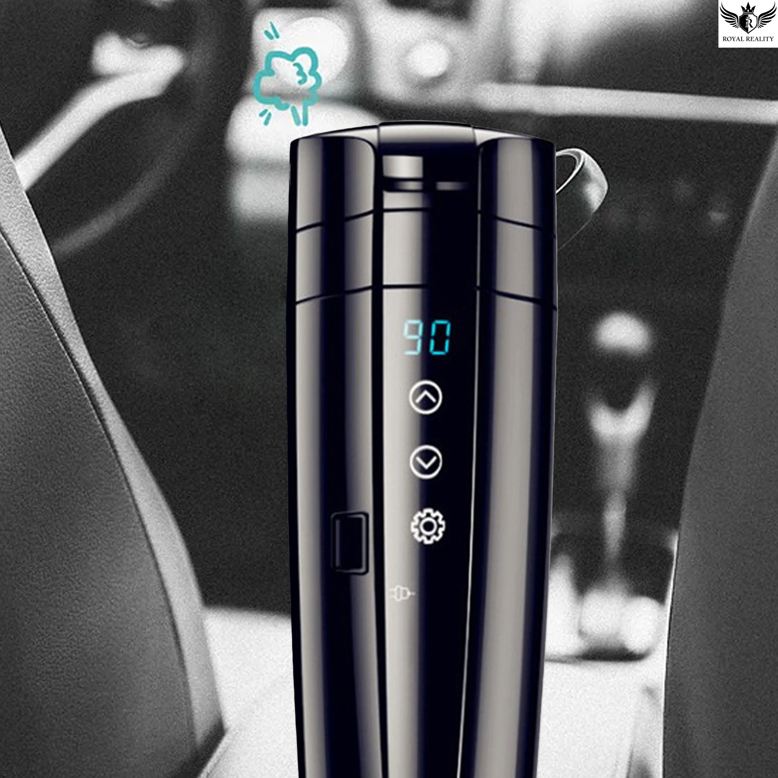 Black electronic device with digital display and control buttons, possibly a humidifier or similar gadget, in a car interior setting.