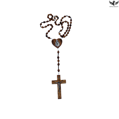 Wooden rosary with heart pendant and cross on a white background