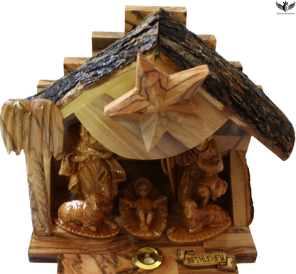 Wooden nativity scene with star and figures, featuring Bethlehem text.