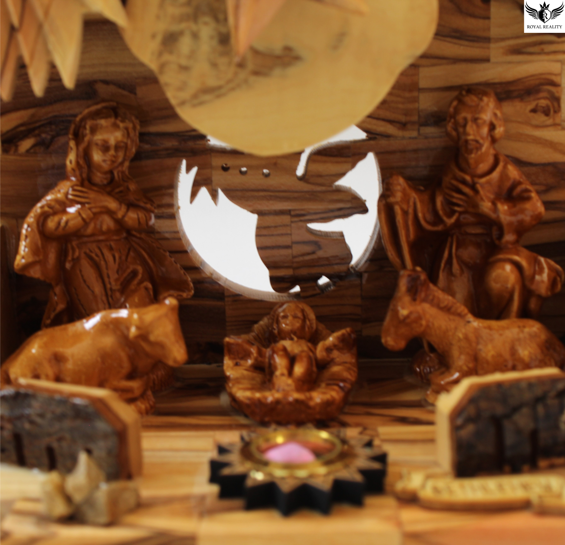 Wooden nativity scene with Mary, Joseph, and baby Jesus in a manger.