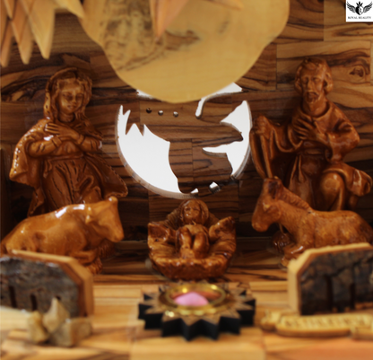 Wooden nativity scene with Mary, Joseph, and baby Jesus in a manger.