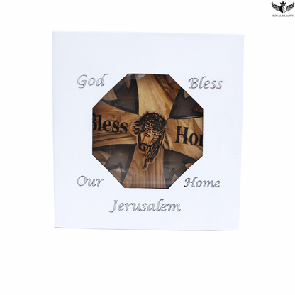 Wooden cross with engraved text on a white background