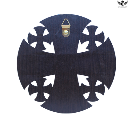Decorative black and white cross design with a small gold emblem on a white background