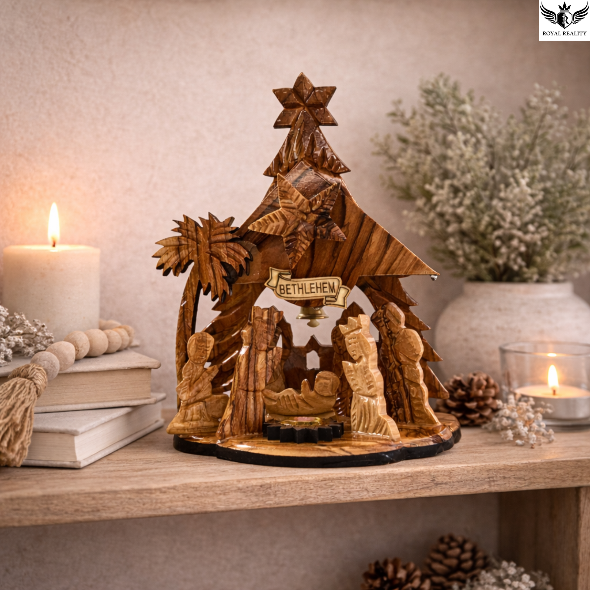 Wooden nativity scene with 'Bethlehem' sign on a table with candles and decor.