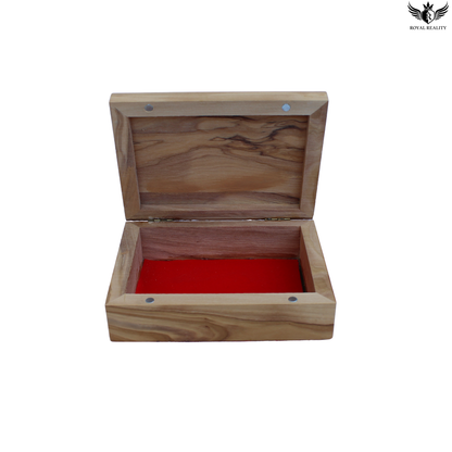 Wooden jewelry box with a red interior on a white background