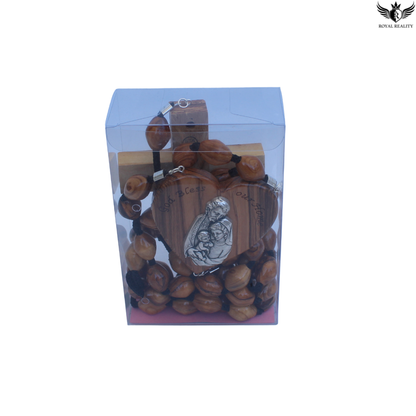Wooden rosary with a religious pendant in a clear packaging box on a white background.