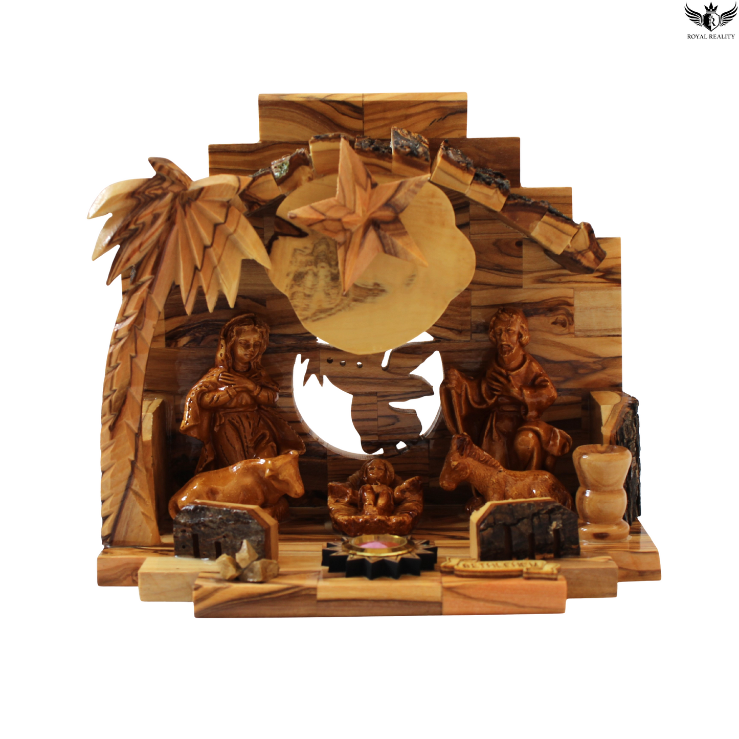 Wooden nativity scene with carvings of figures and animals on a white background