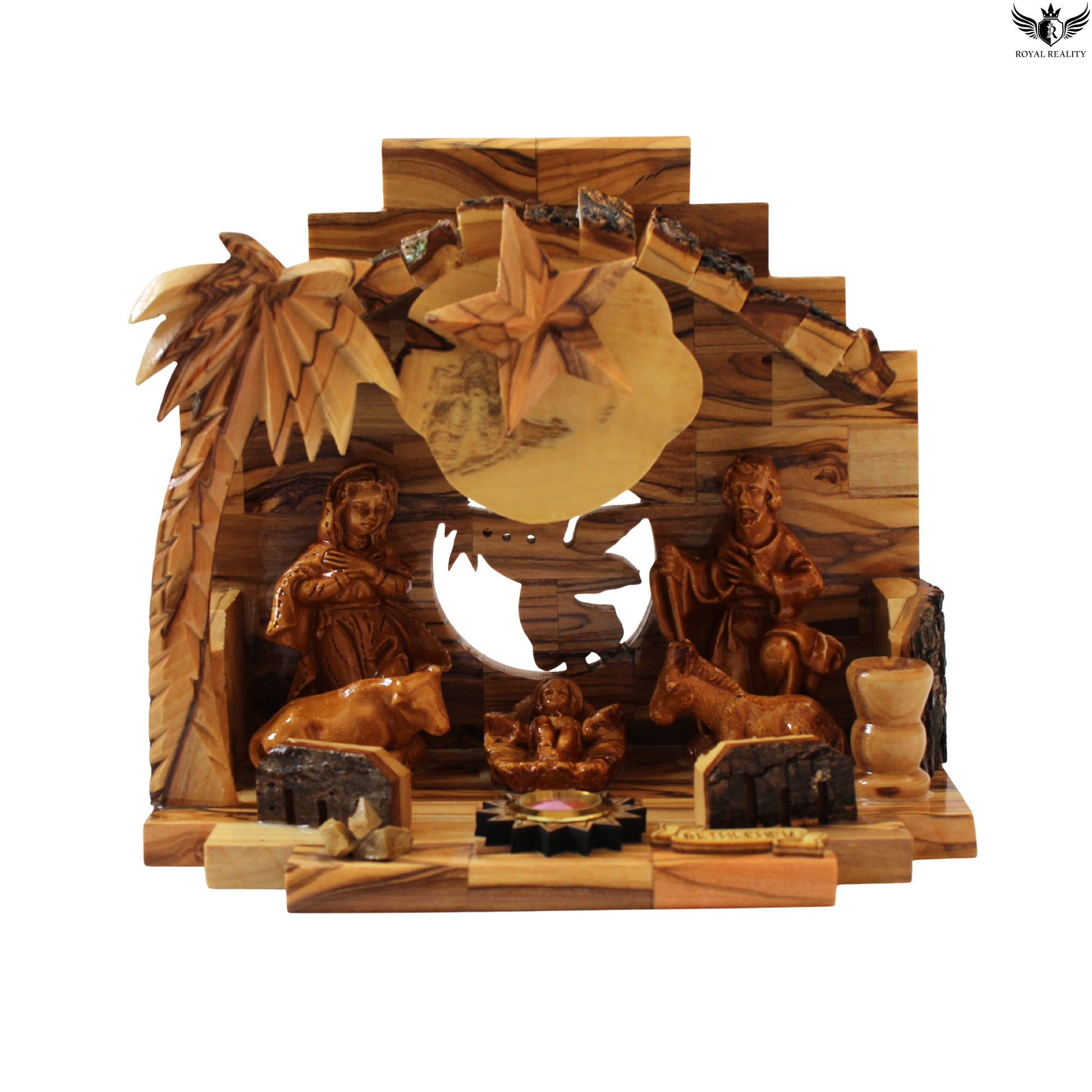 Wooden nativity scene with carvings of figures and animals on a white background