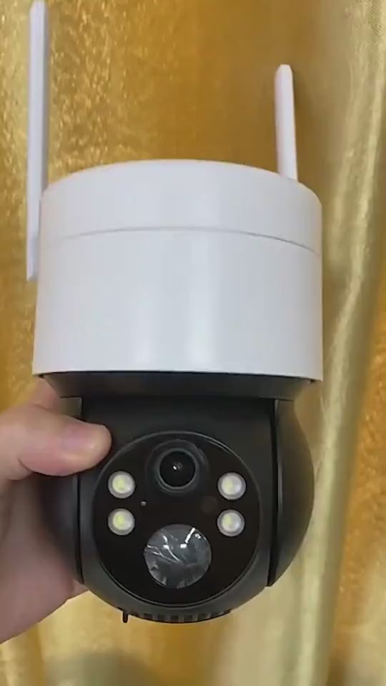"Person holding security camera showing installation flexibility"