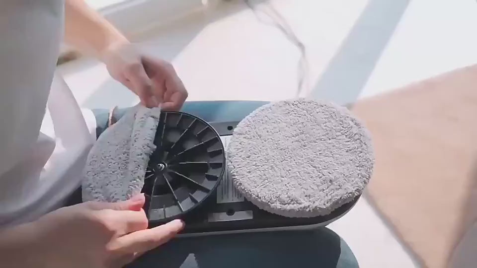 video User attaching microfiber pad to the smart window cleaner